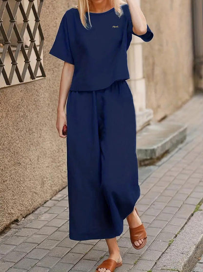 Two-Piece Crew Neck Loose Fit Outfit - Soft Polyester Short Sleeve Top & Wide Leg Pants Set for Elegant Women - Spring/Summer Casual Wear, Solid Color, No Printing, Woven Fabric